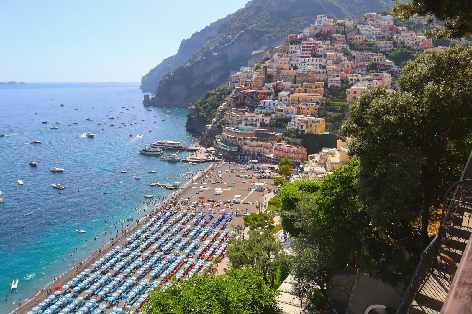 A stunning aerial view of Positano's vibrant coastline, showcasing its colorful buildings and azure sea.