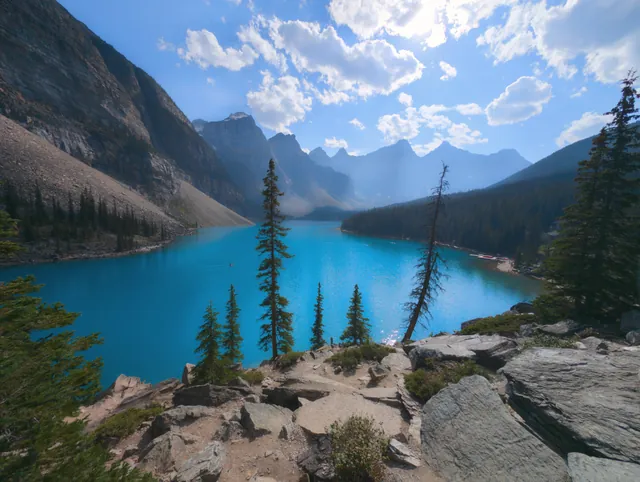 Breathtaking view of Moraine Lake with turquoise waters surrounded by mountains in Banff National Park, Canada.
