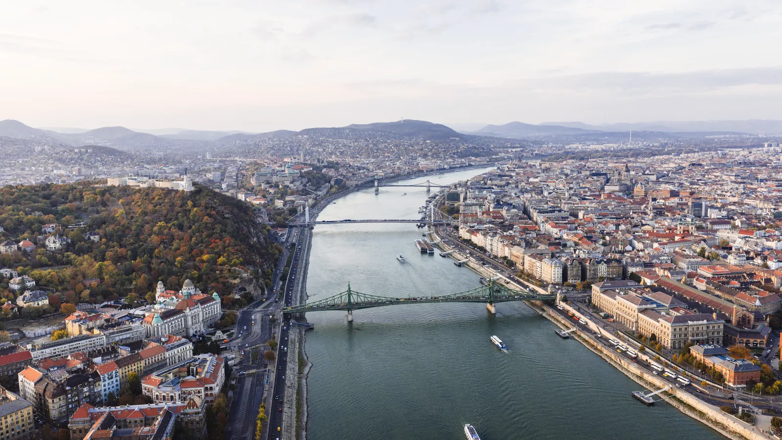 Stunning aerial view of Budapest, showcasing the Danube River, bridges, and cityscape.
