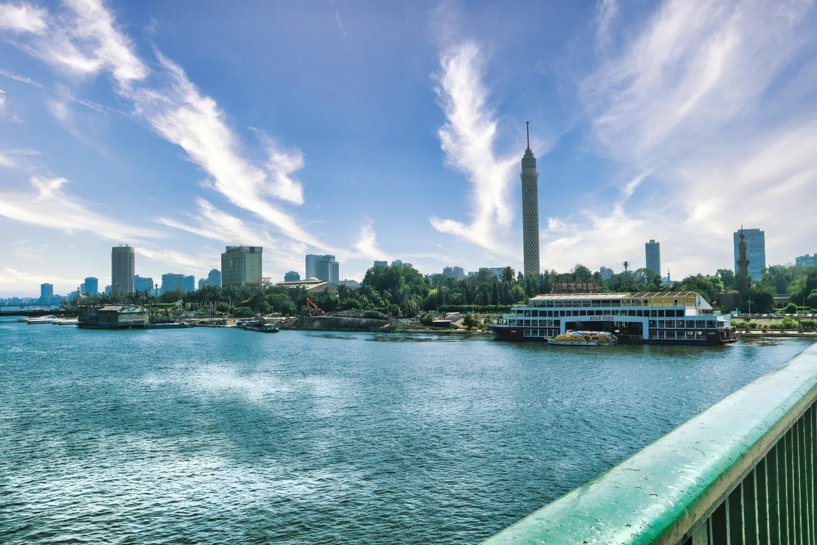 Stunning daytime view of Cairo skyline featuring the Nile River and Cairo Tower.
