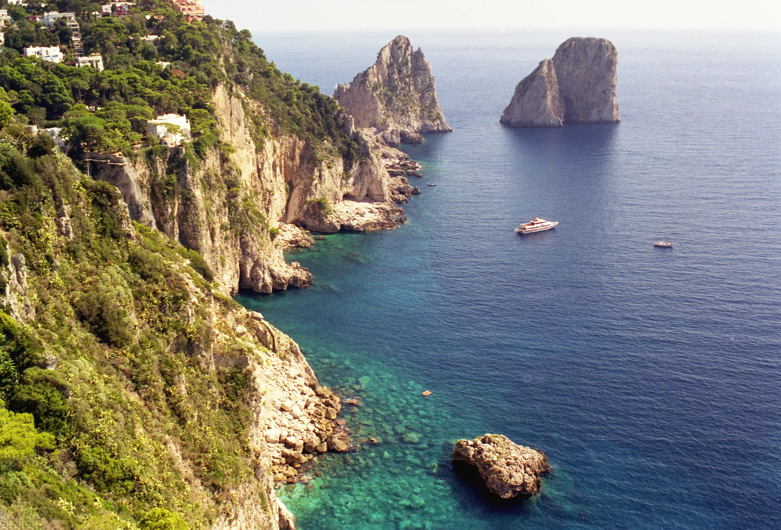 Breathtaking view of the cliffs and blue sea at the Isle of Capri, Italy.