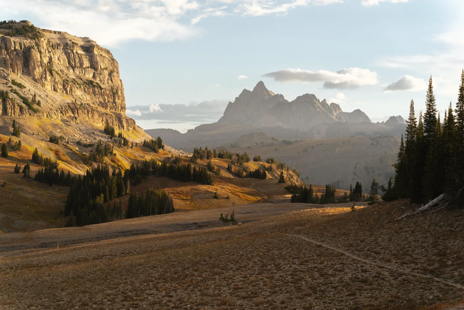 Breathtaking sunrise over the Grand Teton mountains with a vibrant landscape in Wyoming.