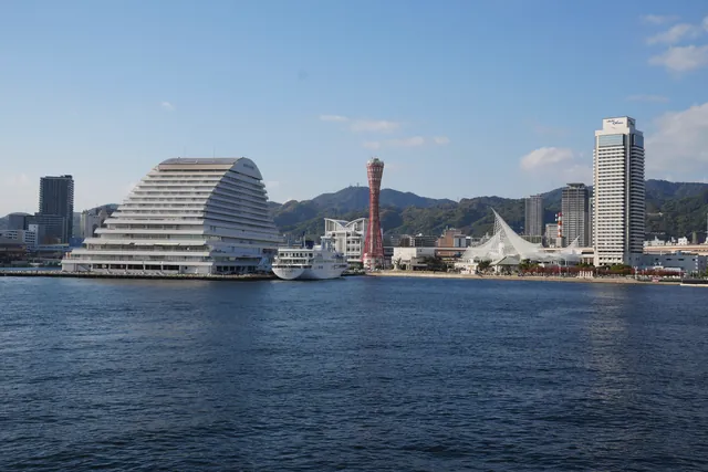 View of Kobe Port skyline featuring iconic harbor tower and modern architecture.