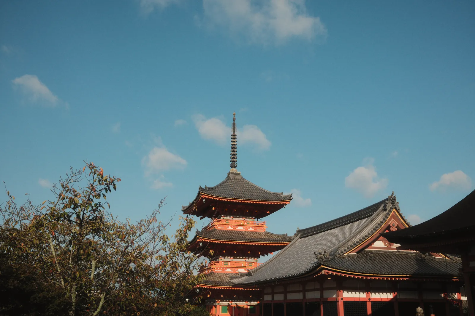 Stunning view of a traditional Japanese pagoda in Kyoto with a clear blue sky.