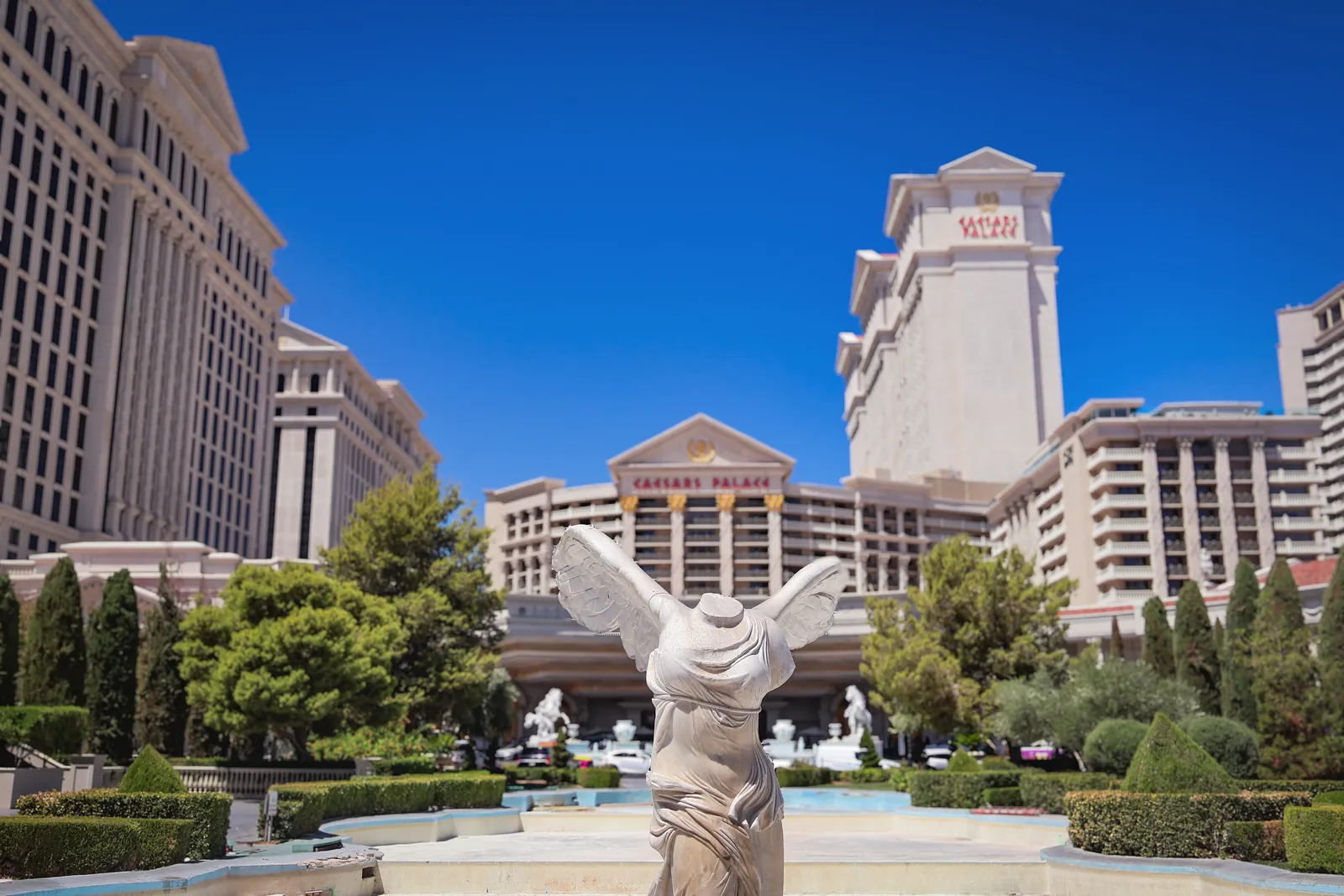 Experience the grandeur of Caesars Palace, Las Vegas, captured under a clear blue sky with iconic architecture.