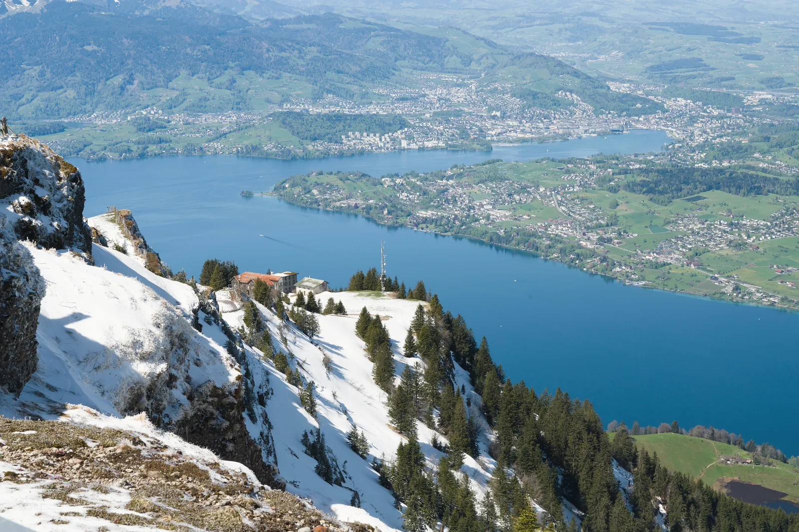 Breathtaking view of Lake Lucerne from snow-covered Mount Rigi, Switzerland.