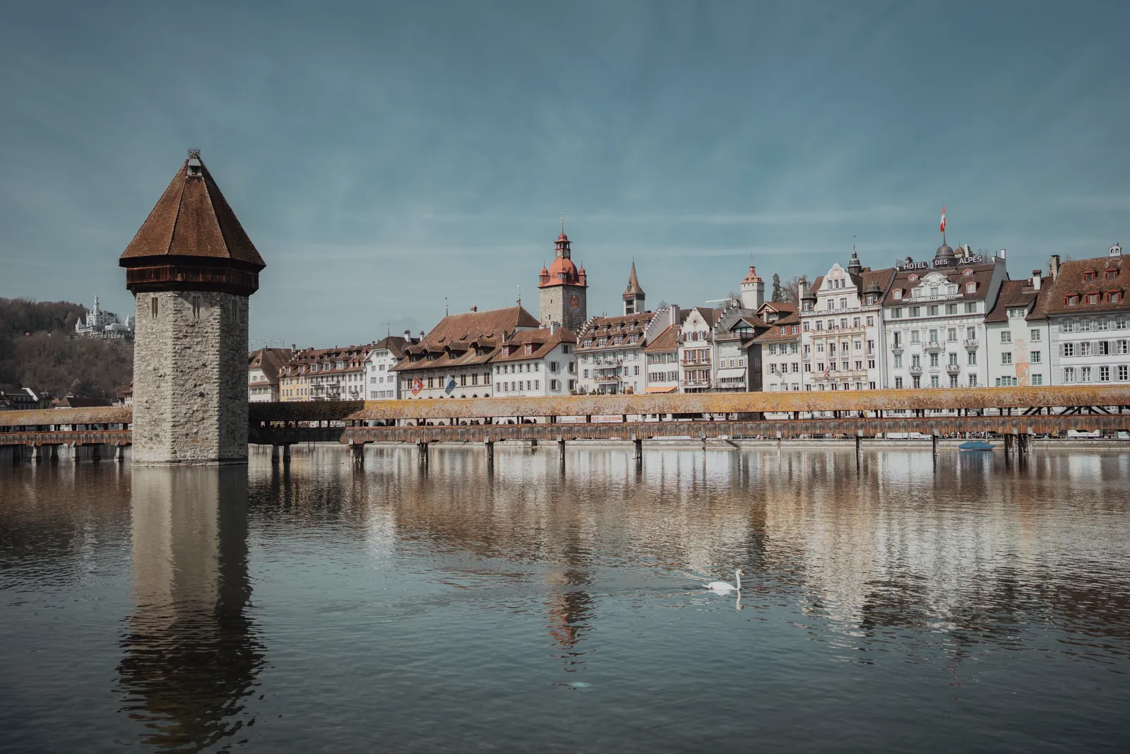 Scenic view of Chapel Bridge and the Water Tower reflecting in Lake Lucerne, Switzerland.