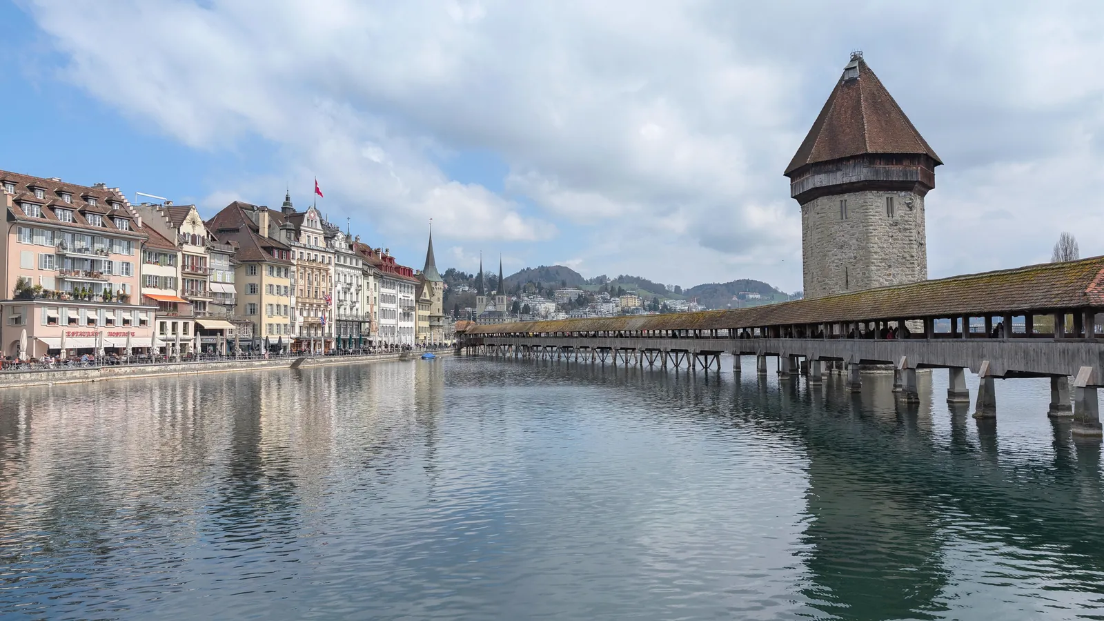 Scenic view of Chapel Bridge and Water Tower over Reuss River in Lucerne, Switzerland.