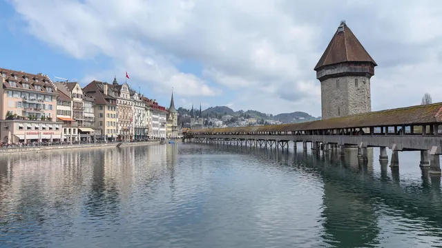 Scenic view of Chapel Bridge and Water Tower over Reuss River in Lucerne, Switzerland.