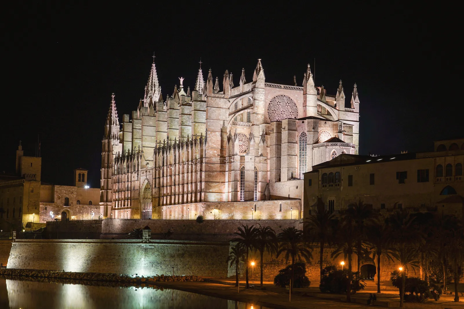 Illuminated gothic Palma Cathedral in Mallorca, Spain captured at night.