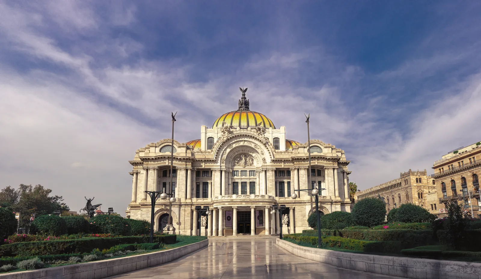 Stunning view of the Palacio de Bellas Artes in Mexico City under a blue sky.
