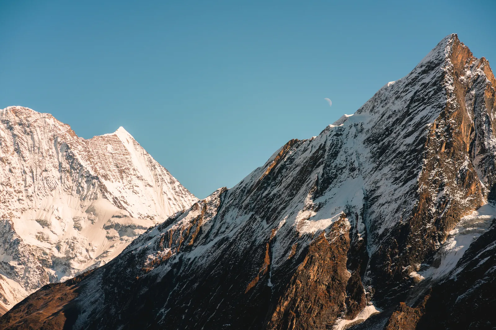 Breathtaking view of snow-covered Himalayan peaks under a clear sky, Nepal.