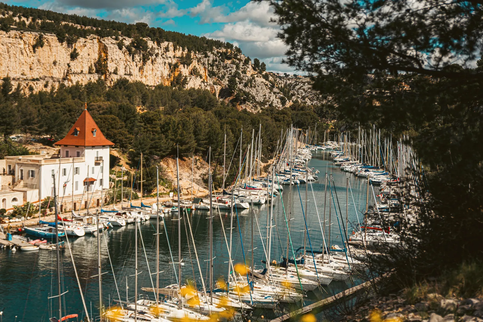 Explore the stunning harbor setting in Cassis, Provence, with picturesque boats.