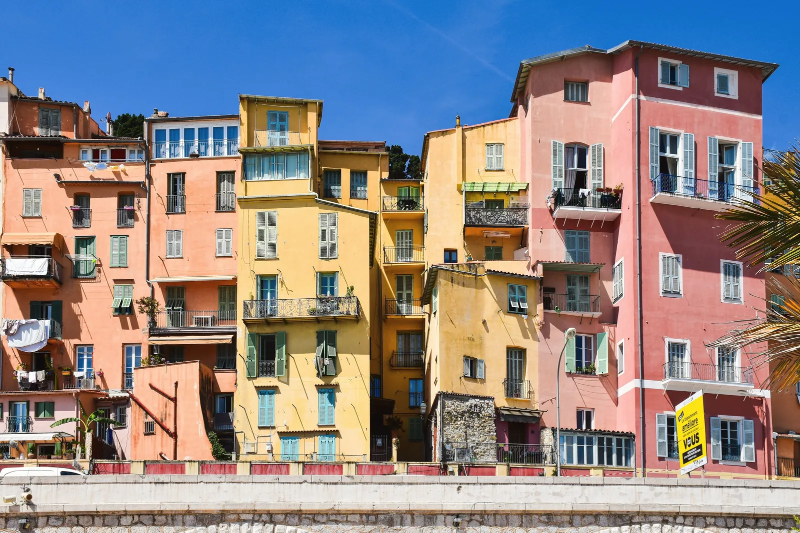 Vibrant buildings in Menton, showcasing French Riviera charm and Mediterranean architecture.