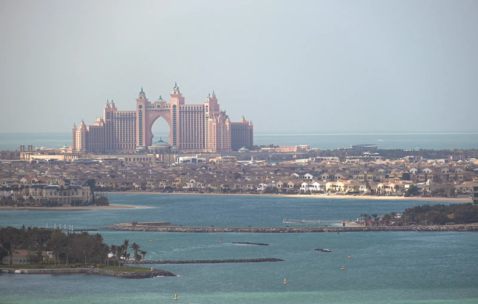 A stunning aerial view of Atlantis The Palm resort in Dubai, with the city skyline.
