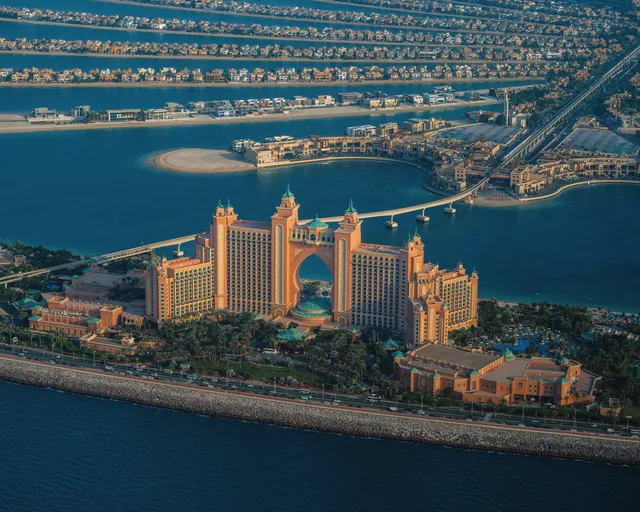 A breathtaking aerial view of Atlantis The Palm resort with surrounding water and palm-shaped islands in Dubai.