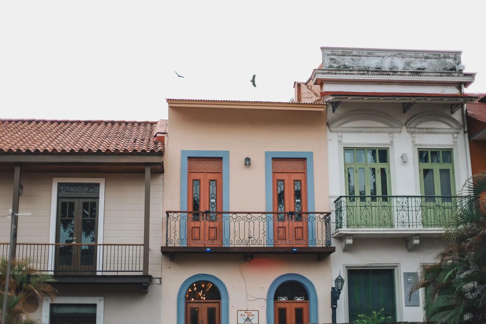 Vibrant colonial-style buildings with balconies in Panama City.