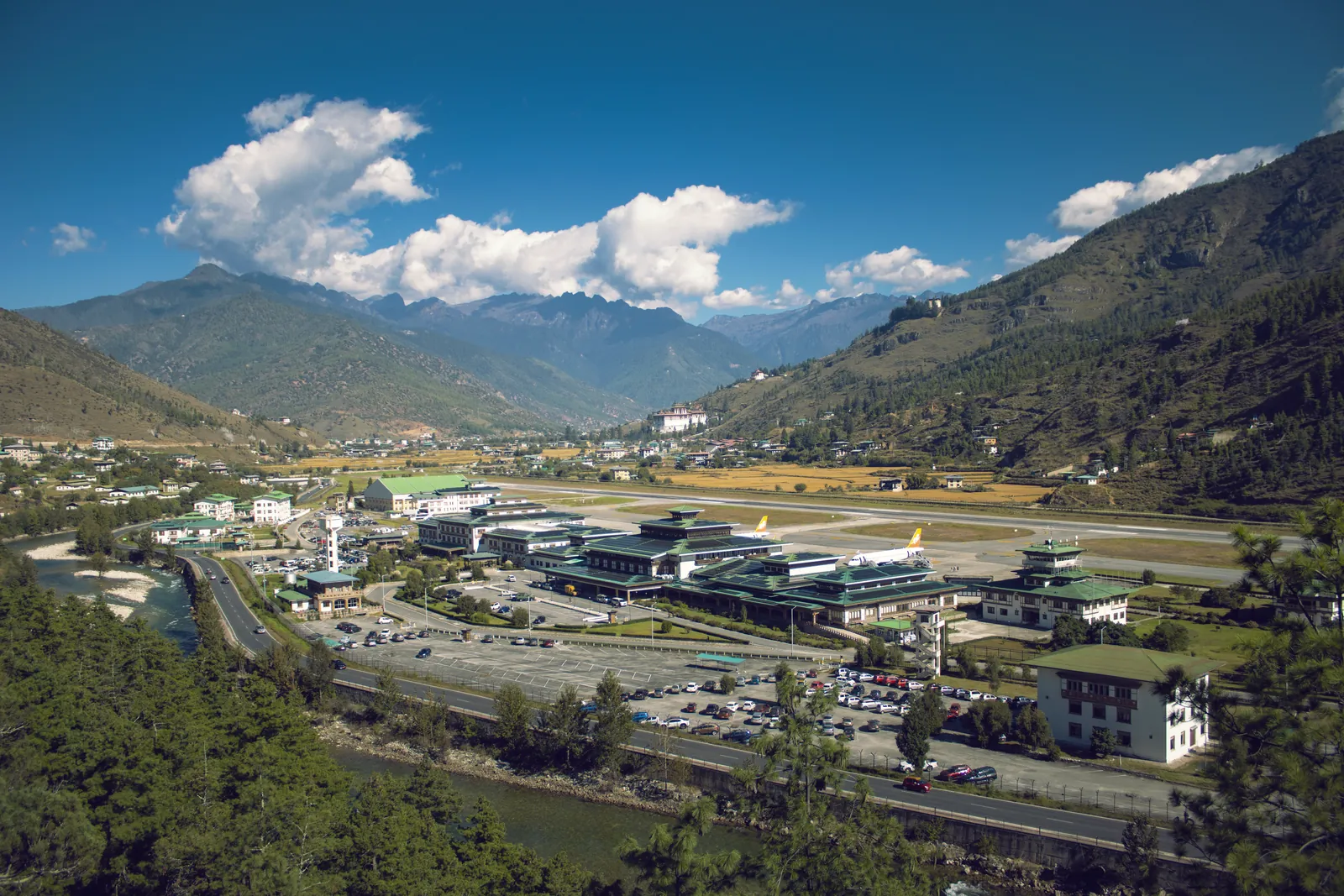 Scenic aerial view of Paro Airport nestled in the Bhutan mountains.