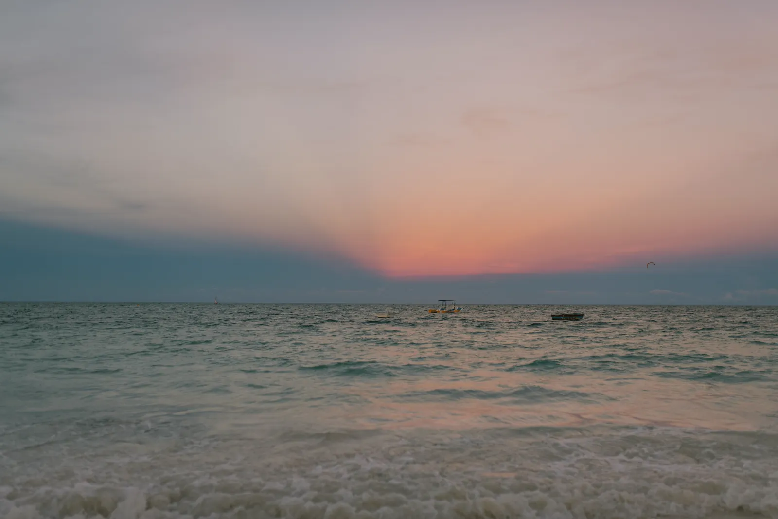 Majestic scenery of rippling sea under sundown sky with pink sunlight in summer