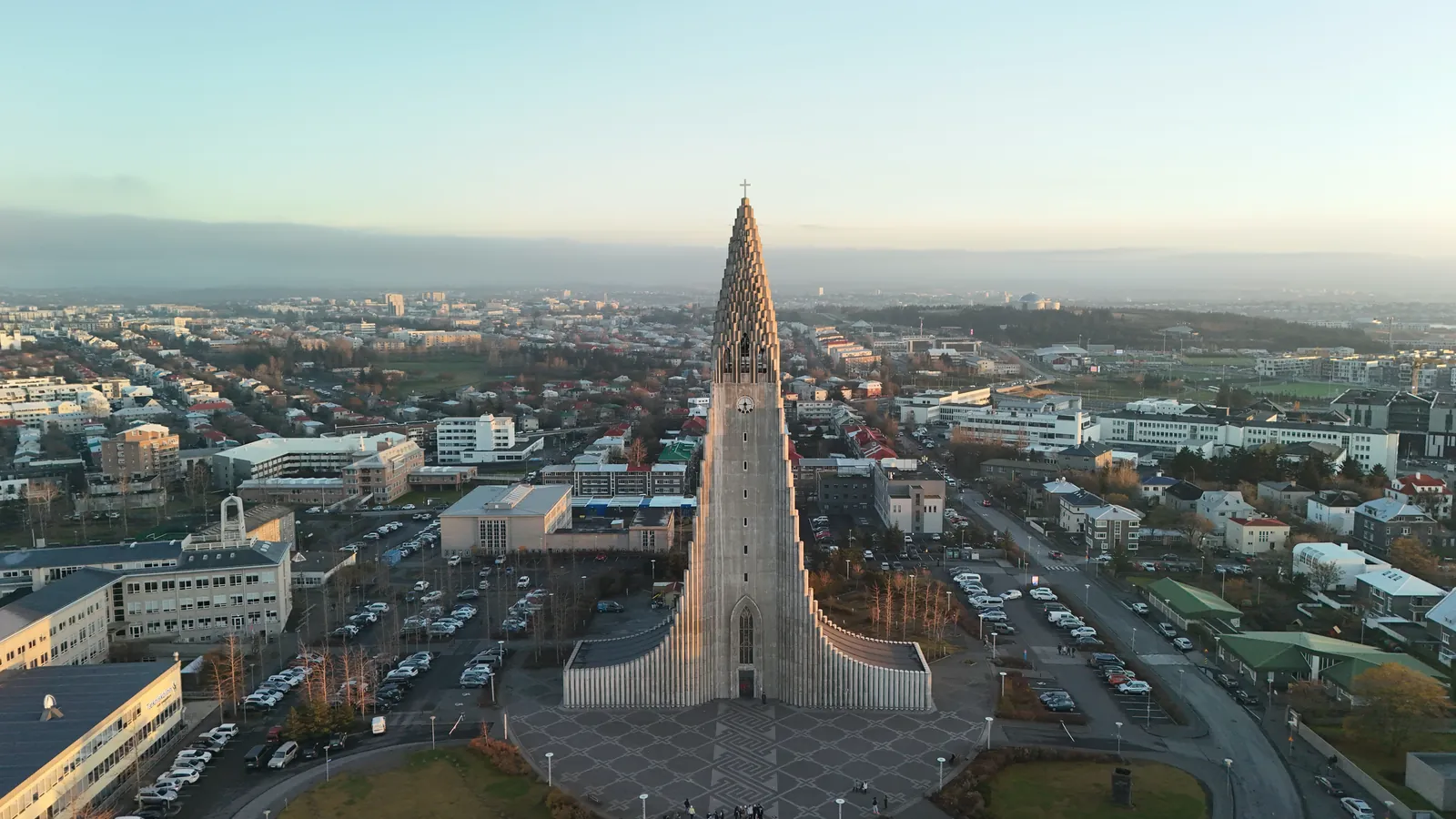 Stunning aerial shot of Hallgrímskirkja in Reykjavik, Iceland, at sunrise showcasing the city's architecture.
