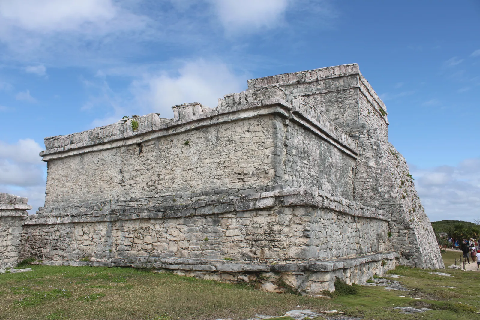Explore the historic Mayan ruins at Tulum in Mexico, showcasing ancient stone architecture under a clear blue sky.