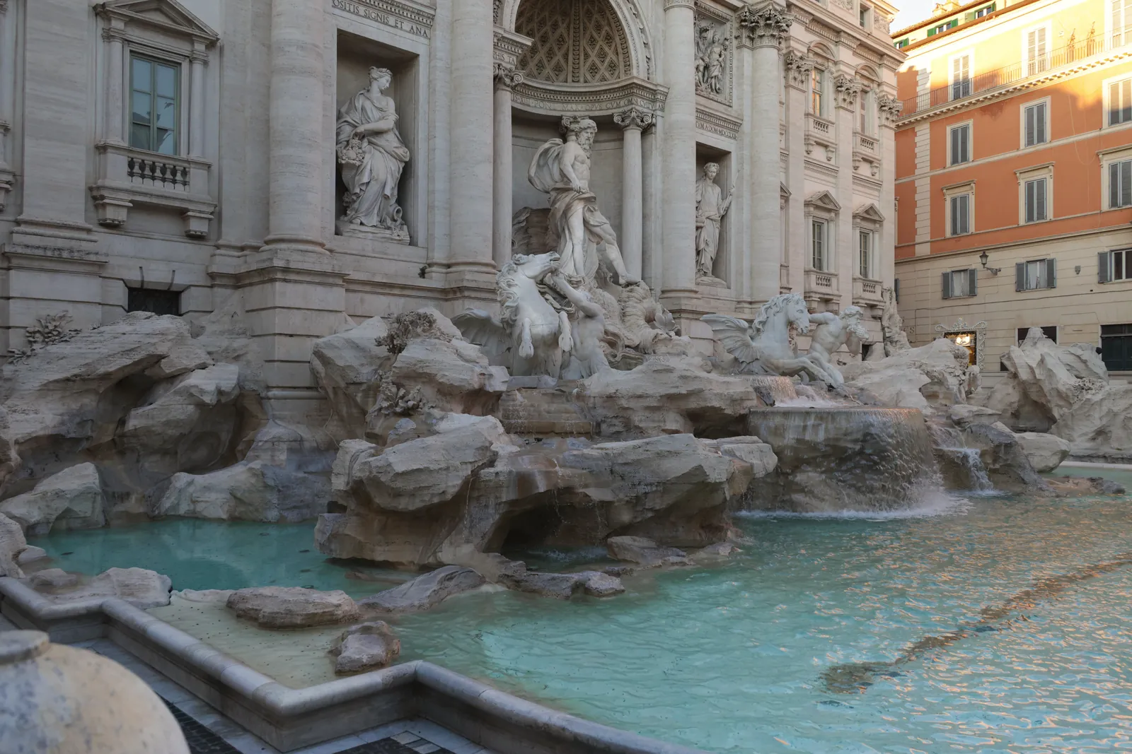 Captivating view of the Trevi Fountain in Rome, showcasing intricate sculptures and turquoise waters.