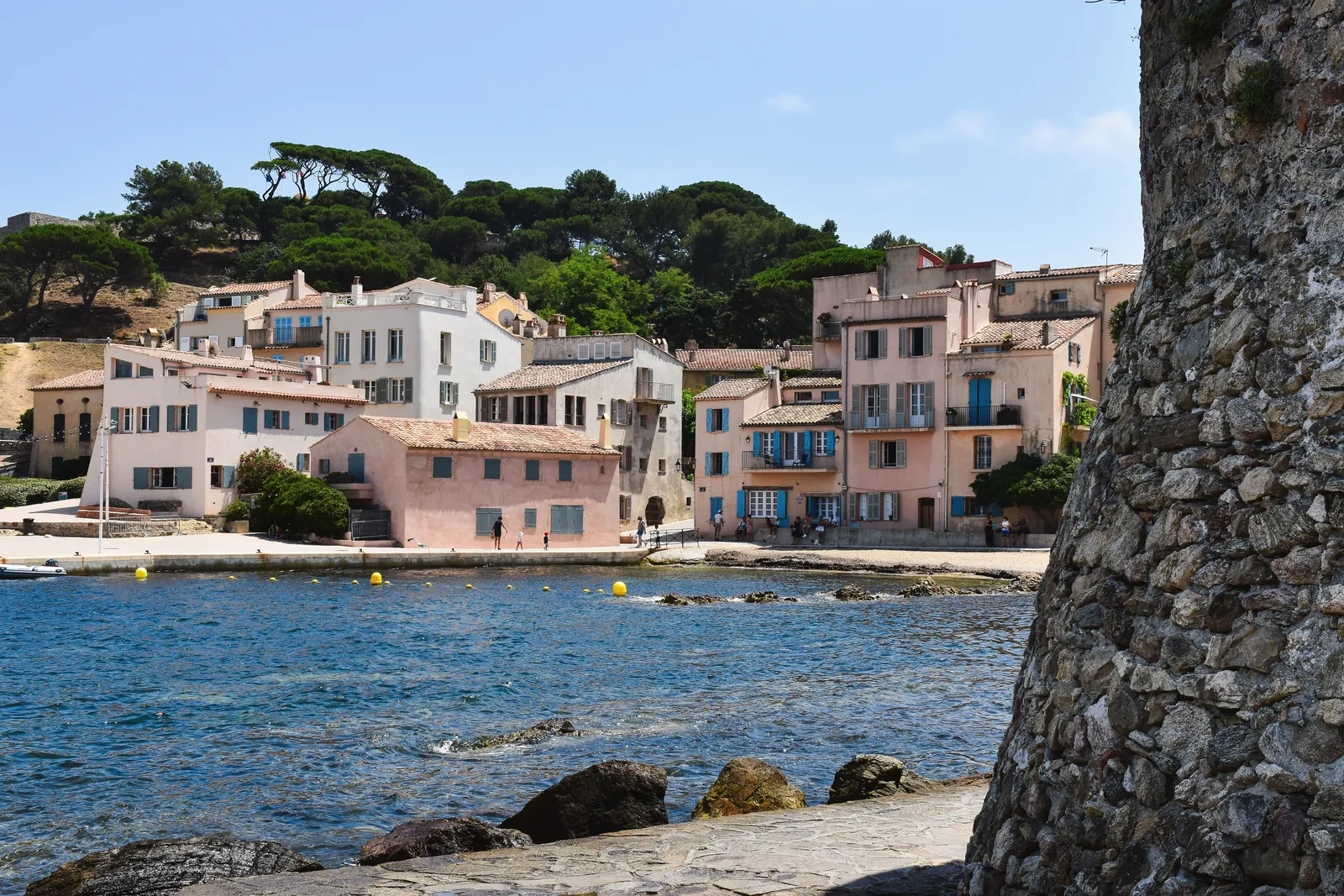 Picturesque view of colorful waterfront buildings in Saint Tropez, capturing the essence of the French Riviera.