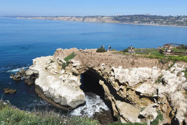 Breathtaking view of La Jolla Cove with natural sea caves and picturesque shoreline in San Diego.