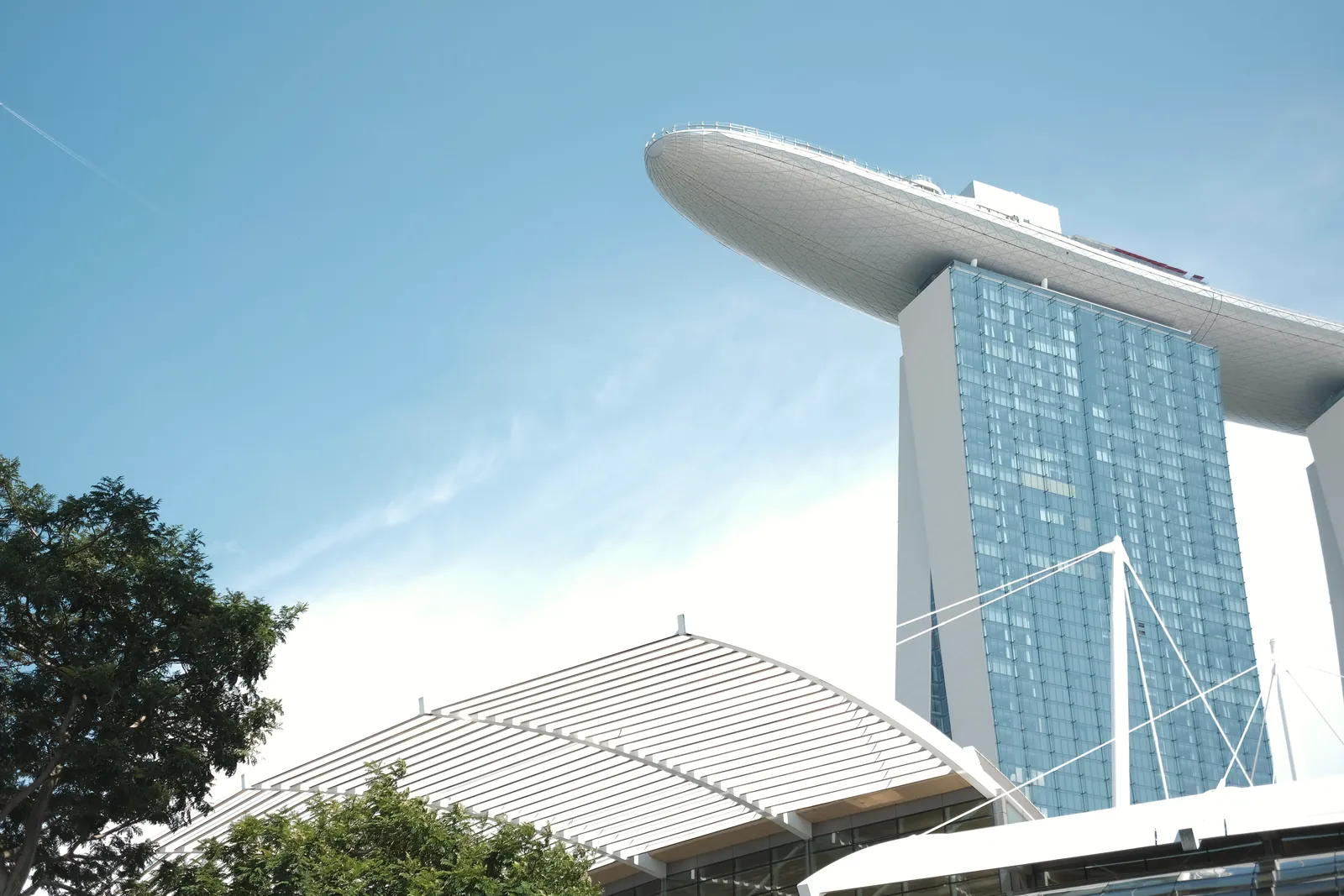 Capture of Marina Bay Sands and ArtScience Museum against a clear blue sky in Singapore.