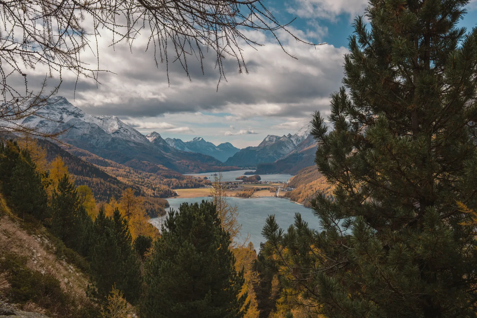 Breathtaking view of the alpine lakes and mountains in Graubünden, Switzerland during autumn.
