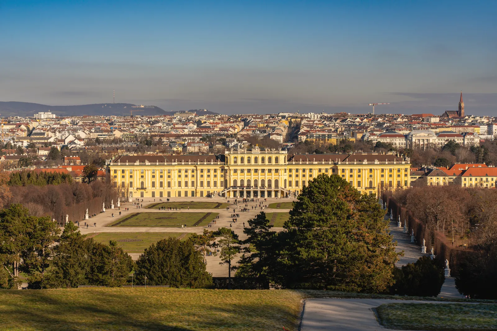 A captivating aerial view of the iconic Schönbrunn Palace in Vienna, surrounded by beautiful gardens.