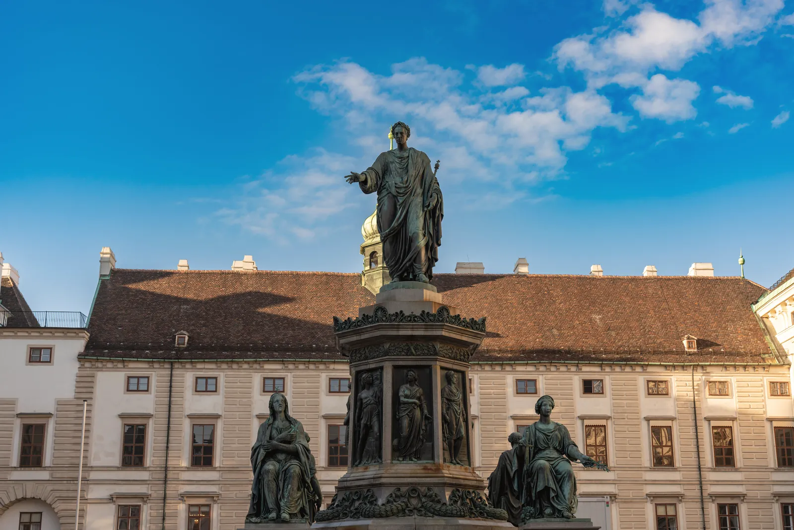 Statue in Vienna's Hofburg Palace captures a classic architectural scene.