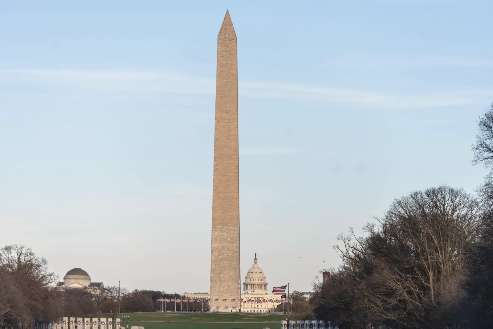 Stunning view of Washington Monument with US Capitol in the background during the day.